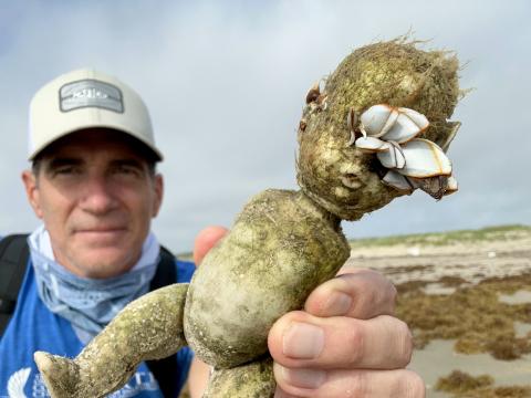Jace Tunnell holding up creepy doll