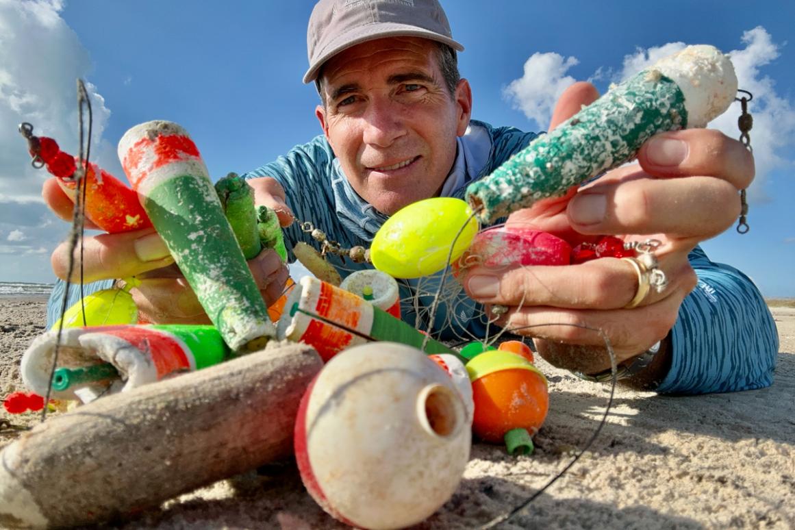 Jace Tunnell with discarded fishing bobbers